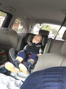 sweet toddler asleep in car seat 
